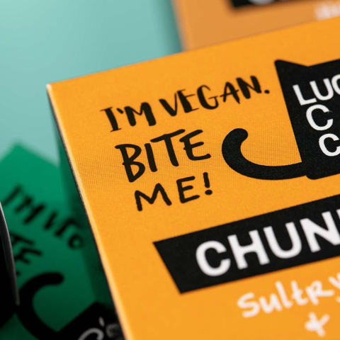 Typographic detail on food product packaging  'I'm Vegan, Bite Me' .