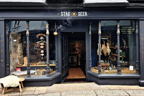New brand logo for Stag + Seer painted onto the olde world Shop front in Totness.