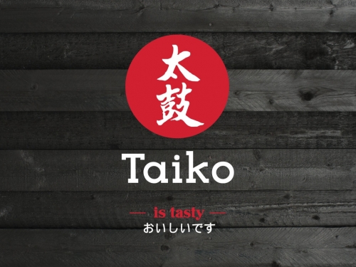 Logo design for Taiko Sushi brand on old black wooden boards.